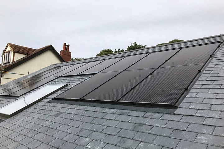 Slate Tiles solar panels Black solar panels built into a grey roof