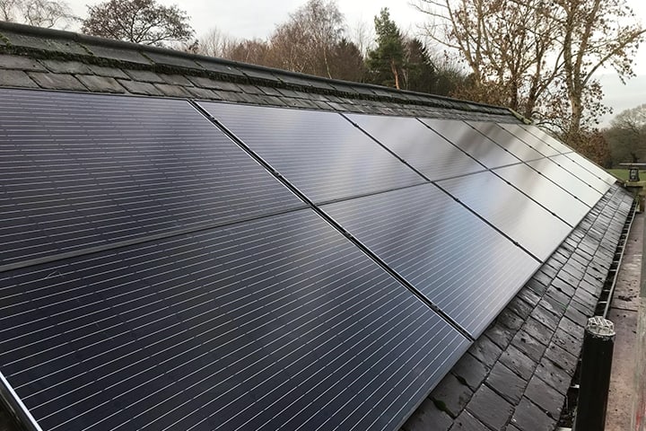 Solar Panels Slate Roof Black solar panels on a roof with grey slate tiles