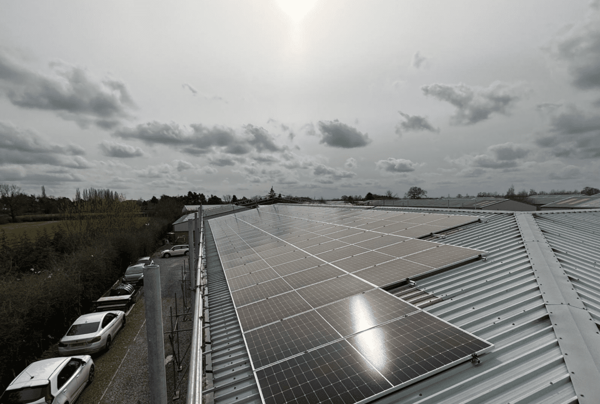 Screenshot 2023-03-15 at 17.27.23 Black solar panels on a warehouse roof