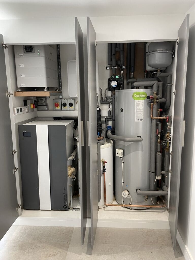 Plant room with Ground Source Heat Pump Unit and Hot Water Cylinder